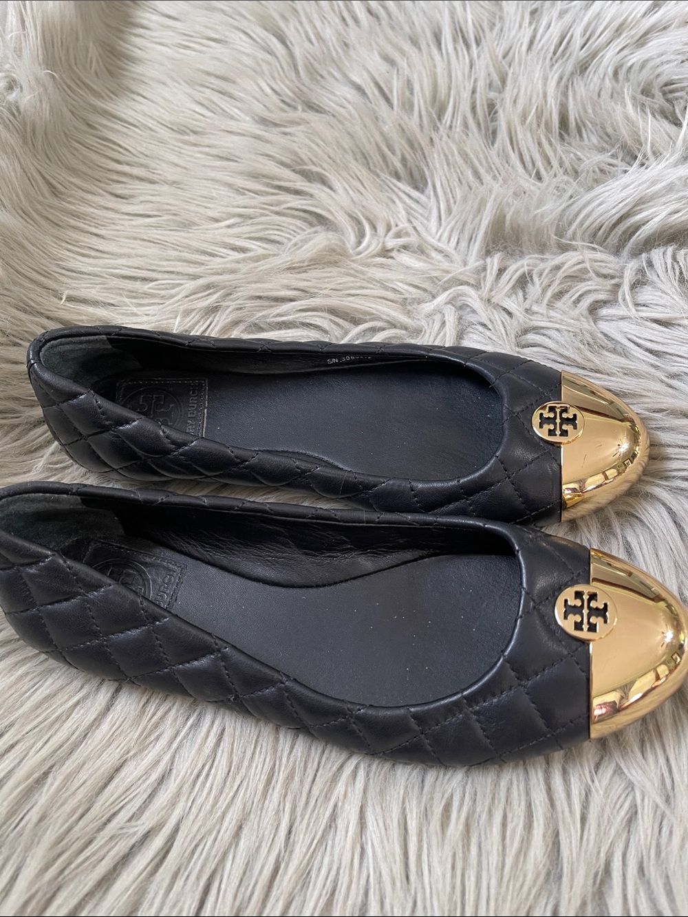Tory Burch Black Quilted Leather Flats with Gold Cap Toe‎ Logo